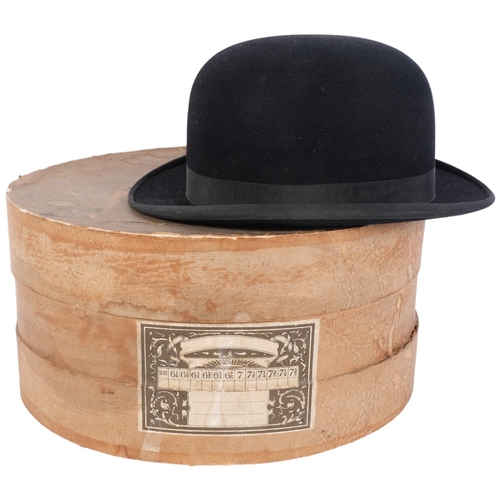 1004 - A black bowler hat, by Dunn & Co, with cardboard hat box