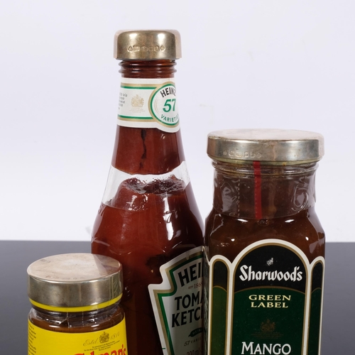 1015 - A ketchup bottle with silver top, 20cm, and 2 other condiment jars with hallmarked silver tops