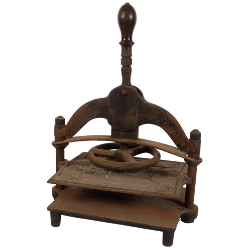 1025 - A 19th century cast-iron book press, with turned wood handle, H47cm