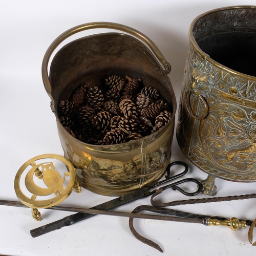 1026 - A brass coal bucket, and a brass coal bin with lion mask ring handles and armorial decoration, conta... 