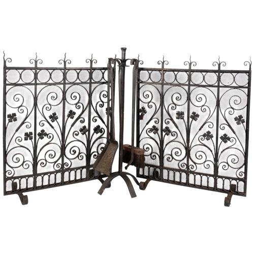 1029 - A 4-piece wrought-iron companion set on stand, H64cm, and pair of wrought-iron and mesh fire guards