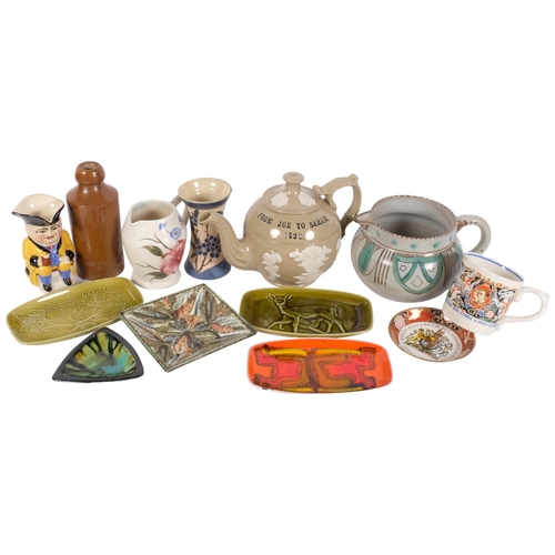 1039 - A 1920s stoneware teapot, H17cm, a glazed terracotta jug, a Laura Knight George VI mug, Poole Delphi... 