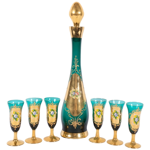 1040 - An Italian glass decanter and liqueur glasses, with enamelled and gilded decoration, H42cm