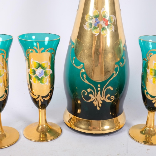 1040 - An Italian glass decanter and liqueur glasses, with enamelled and gilded decoration, H42cm