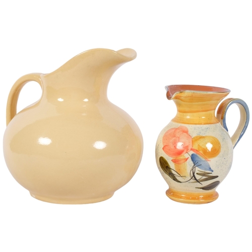 1044 - A cream glazed French ceramic jug, H25cm, and a smaller jug with painted decoration