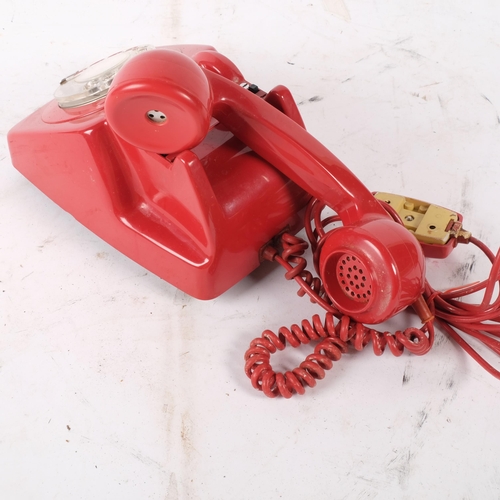 793 - A red plastic telephone