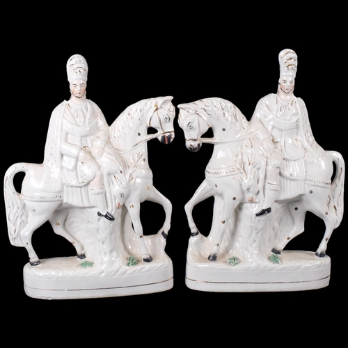 821 - A pair of Staffordshire ceramic figures, modelled as Highland hunters on horseback, facing each othe... 