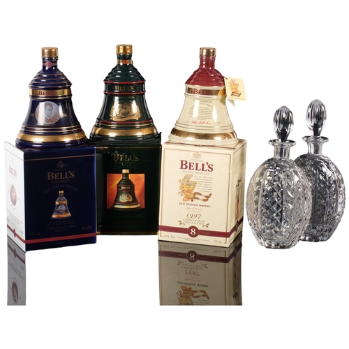 856 - 3 boxed Bell's commemorative Whisky decanters, including Christmas decanter (all full)