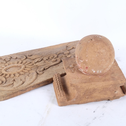 864 - An Indian hardwood panel with floral carved decoration, L63cm, and a carved hardwood finial