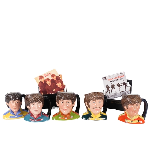 920 - A set of 5 Royal Doulton Beatles character jugs, H13cm, and 2 sets of CDs