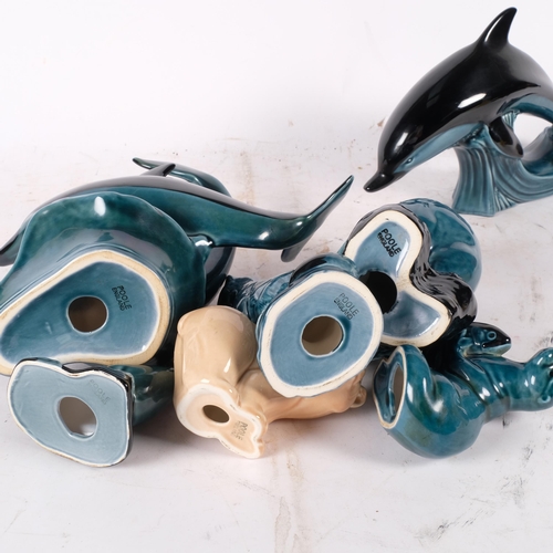 932 - A group of 2 Poole Pottery dolphins, H24cm, Poole owl, seal, otter, etc