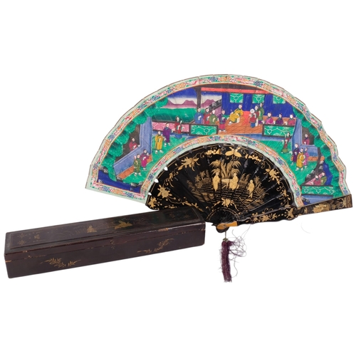 178 - A Chinese Mandarin fan, having a double-sided polychrome leaf painted with figures in buildings and ... 