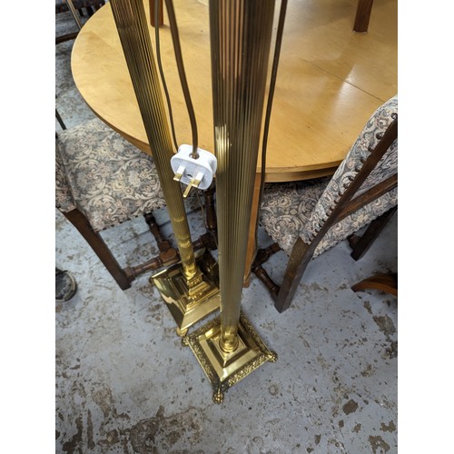 2575 - Two similar brass Corinthian column standard lamps. Tallest height to bayonet 142cm.