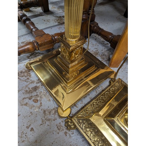 2575 - Two similar brass Corinthian column standard lamps. Tallest height to bayonet 142cm.