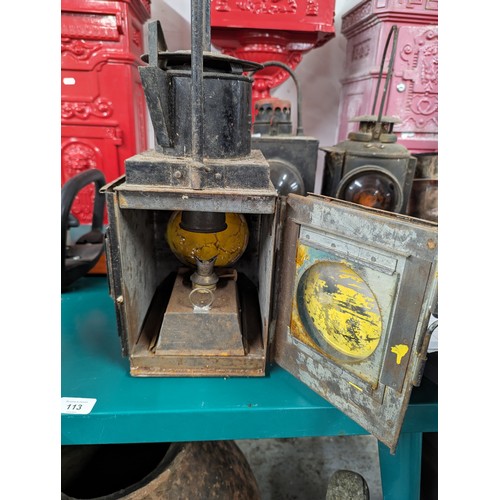 297 - Three vintage railway lanterns, including an Adlake non-sweating lamp, one marked BR(W) and one indi... 