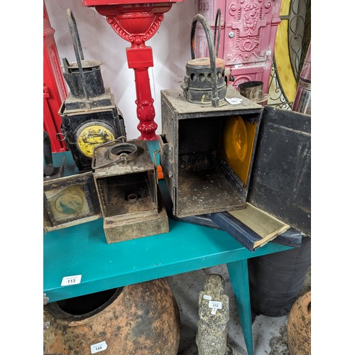 297 - Three vintage railway lanterns, including an Adlake non-sweating lamp, one marked BR(W) and one indi... 