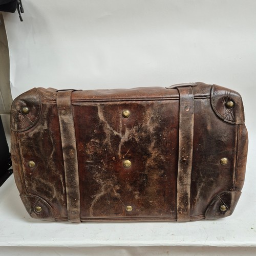 92 - A large Antique leather Gladstone travel bag, with hinged folding sides and leather straps, by John ... 