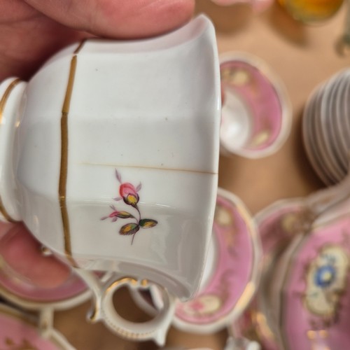 1018 - A Victorian porcelain teapot, sucrier and jug, and 17 cups, 11 saucers, 2 plates and slop bowl