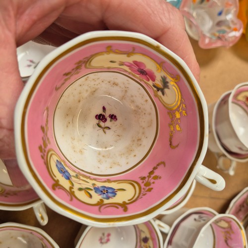 1018 - A Victorian porcelain teapot, sucrier and jug, and 17 cups, 11 saucers, 2 plates and slop bowl