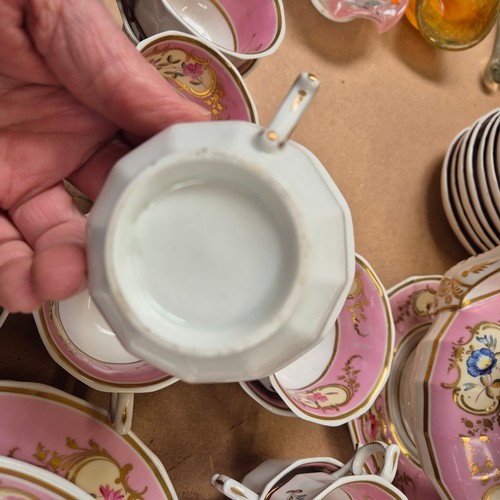 1018 - A Victorian porcelain teapot, sucrier and jug, and 17 cups, 11 saucers, 2 plates and slop bowl