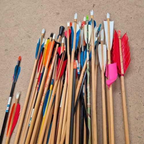 1050 - A large quantity of archery equipment, including boxes of arrows, a bow, wooden box, carrying cases,... 