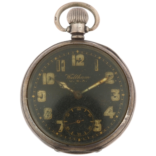 1104 - WALTHAM - a silver open-face keyless pocket watch, black enamel dial with Arabic numerals, cathedral... 