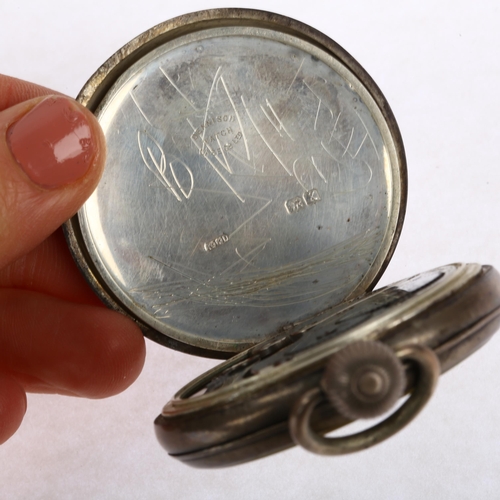 1104 - WALTHAM - a silver open-face keyless pocket watch, black enamel dial with Arabic numerals, cathedral... 