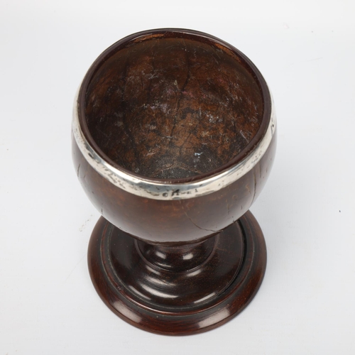 12 - Antique coconut cup, 18th or 19th century, unmarked white metal mounts on rosewood base, height 14.5... 