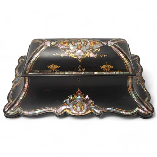 243 - A 19th century papier mache tea caddy, inlaid mother-of-pearl and gilded decoration, with inner lids... 