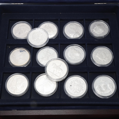 245 - 50 silver commemorative British and Commonwealth coins, all in original capsules and in presentation... 