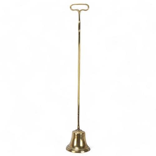 251 - A tall Victorian brass doorstop, height 69cm