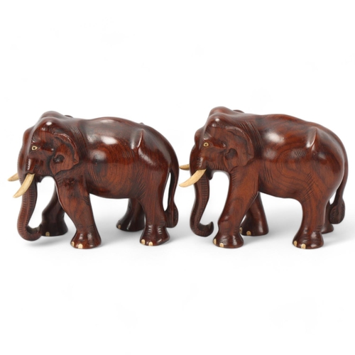 252 - Pair of early 20th century carved hardwood elephants, height 15.5cm