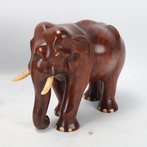 252 - Pair of early 20th century carved hardwood elephants, height 15.5cm