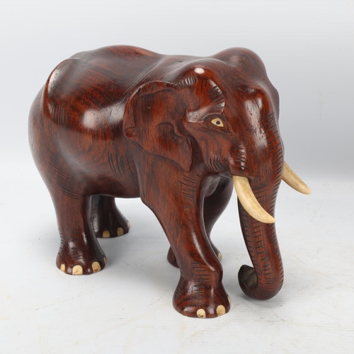 252 - Pair of early 20th century carved hardwood elephants, height 15.5cm