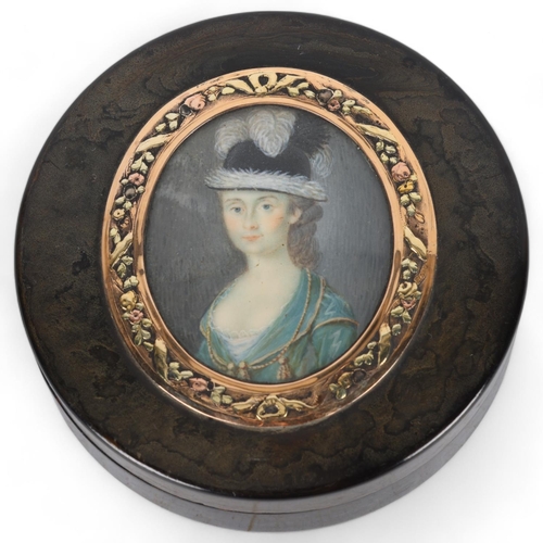 272 - 19th century circular tortoiseshell box, the lid having an inset portrait of a lady, in unmarked gil... 