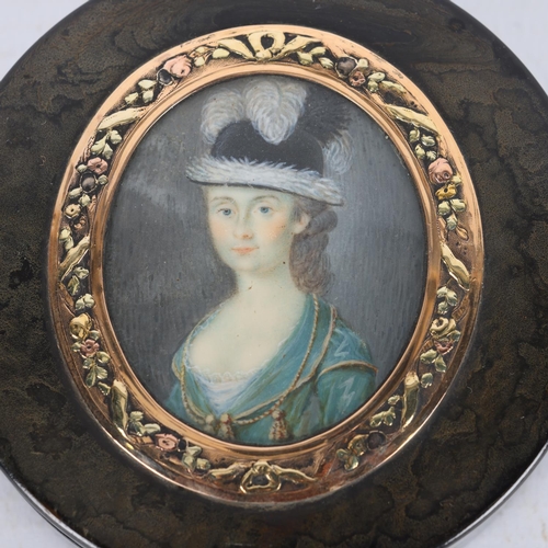 272 - 19th century circular tortoiseshell box, the lid having an inset portrait of a lady, in unmarked gil... 