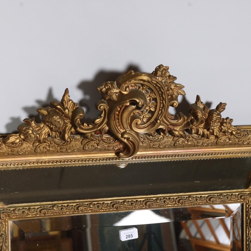 285 - A Venetian style gilt-gesso framed wall mirror, with bevel panels, dimensions excluding pediment 107... 