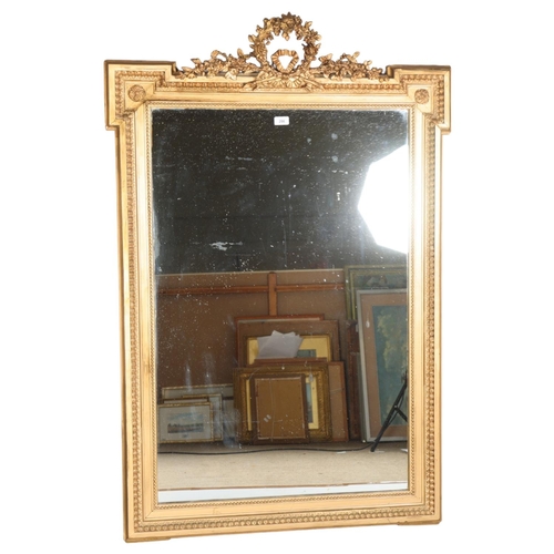 286 - A 19th century gilt-gesso framed wall mirror, with floral wreath pediment, dimensions excluding pedi... 