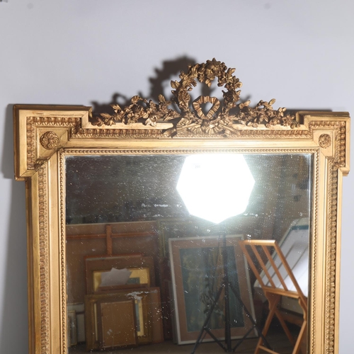 286 - A 19th century gilt-gesso framed wall mirror, with floral wreath pediment, dimensions excluding pedi... 