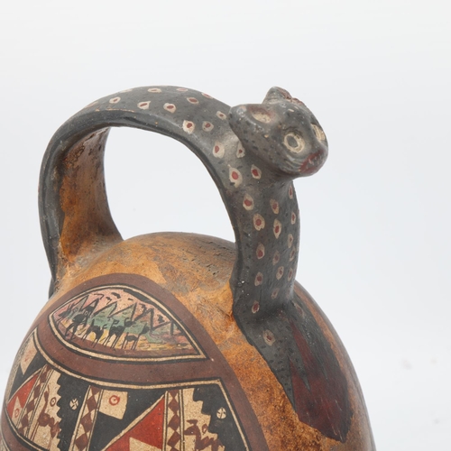 70 - A 16th century Peruvian terracotta ceremonial chicha pot, with puma handle and geometric painted pan... 