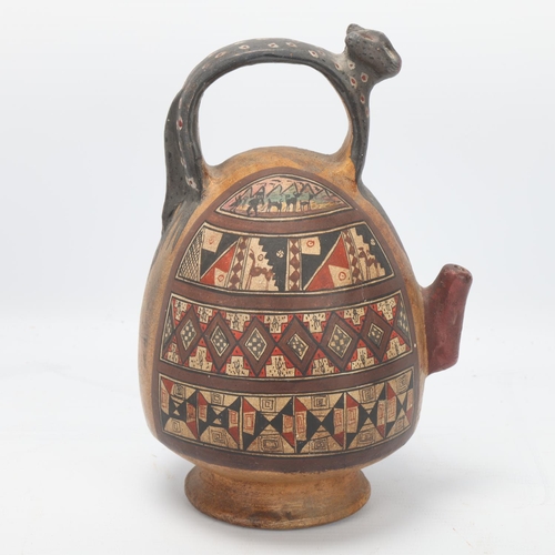 70 - A 16th century Peruvian terracotta ceremonial chicha pot, with puma handle and geometric painted pan... 