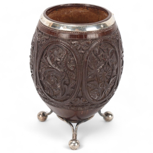 76 - Antique coconut vase, late 18th/early 19th century, with unmarked white metal mounts and relief carv... 