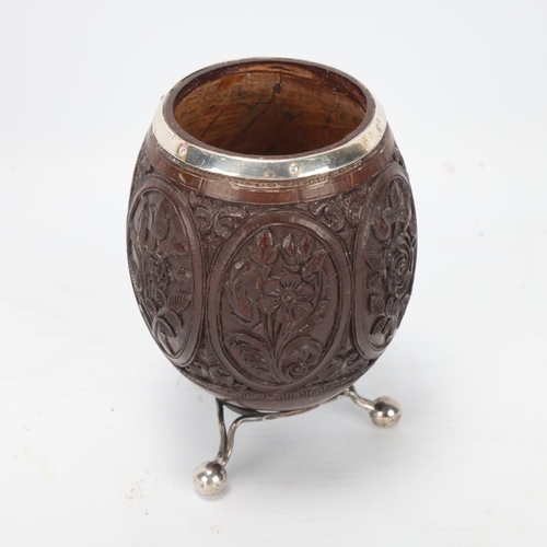 76 - Antique coconut vase, late 18th/early 19th century, with unmarked white metal mounts and relief carv... 