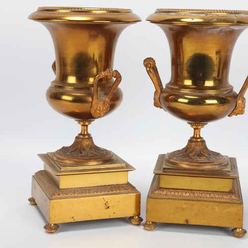 8 - Pair of 19th century gilt-brass campagna form mantel urns on stepped plinths, height 20cm