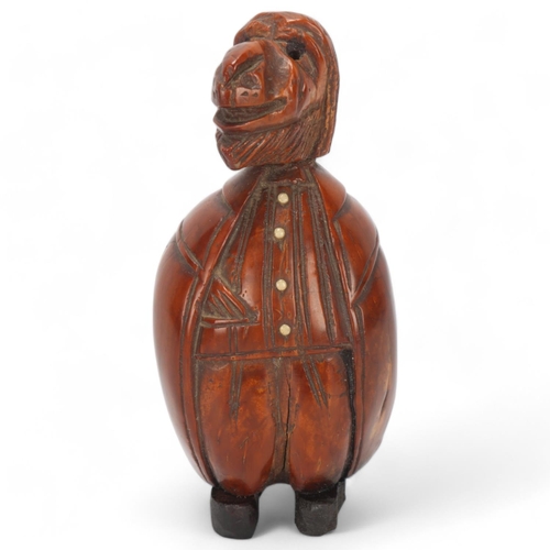 82 - 19th century coquilla nut box in the form of a figure, height 9cm