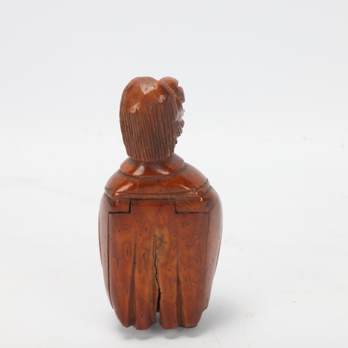 82 - 19th century coquilla nut box in the form of a figure, height 9cm