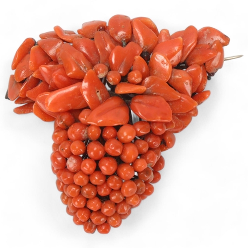 83 - A 19th century coral brooch in the form of a bunch of grapes, height 5cm