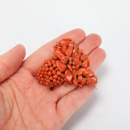 83 - A 19th century coral brooch in the form of a bunch of grapes, height 5cm