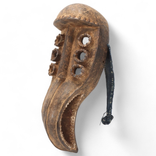 94 - African Grebo carved wood beak mask, Liberia, length 46cm