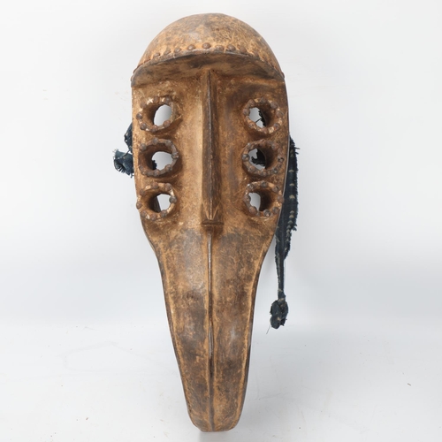 94 - African Grebo carved wood beak mask, Liberia, length 46cm